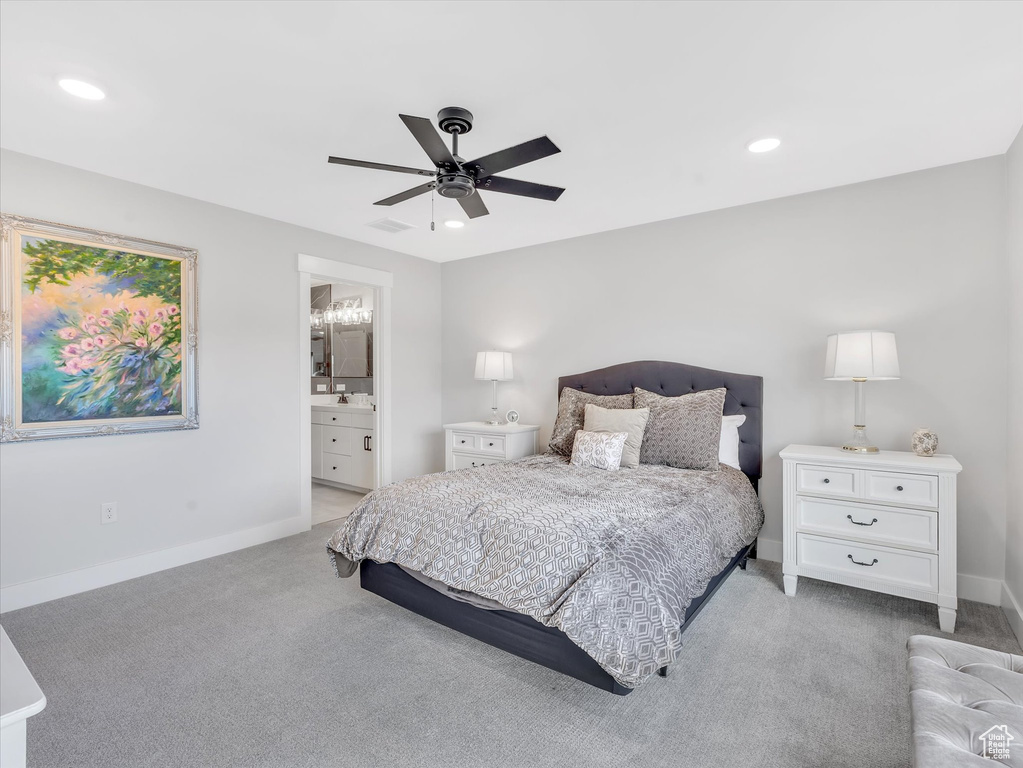 Carpeted bedroom featuring baseboards, recessed lighting, ensuite bathroom, and ceiling fan
