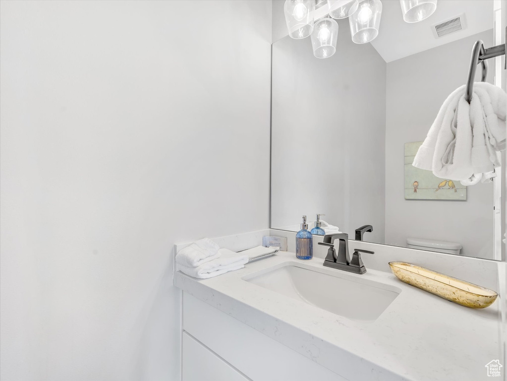 Bathroom with vanity and toilet