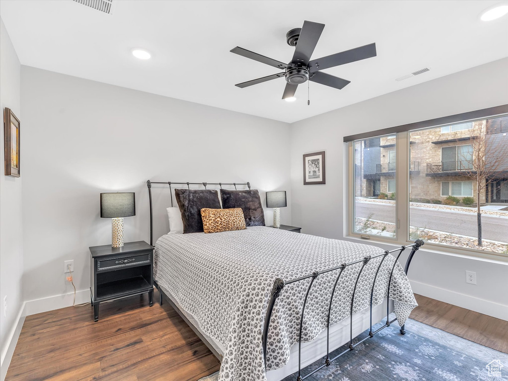 Bedroom featuring wood finished floors, baseboards, ceiling fan, and recessed lighting