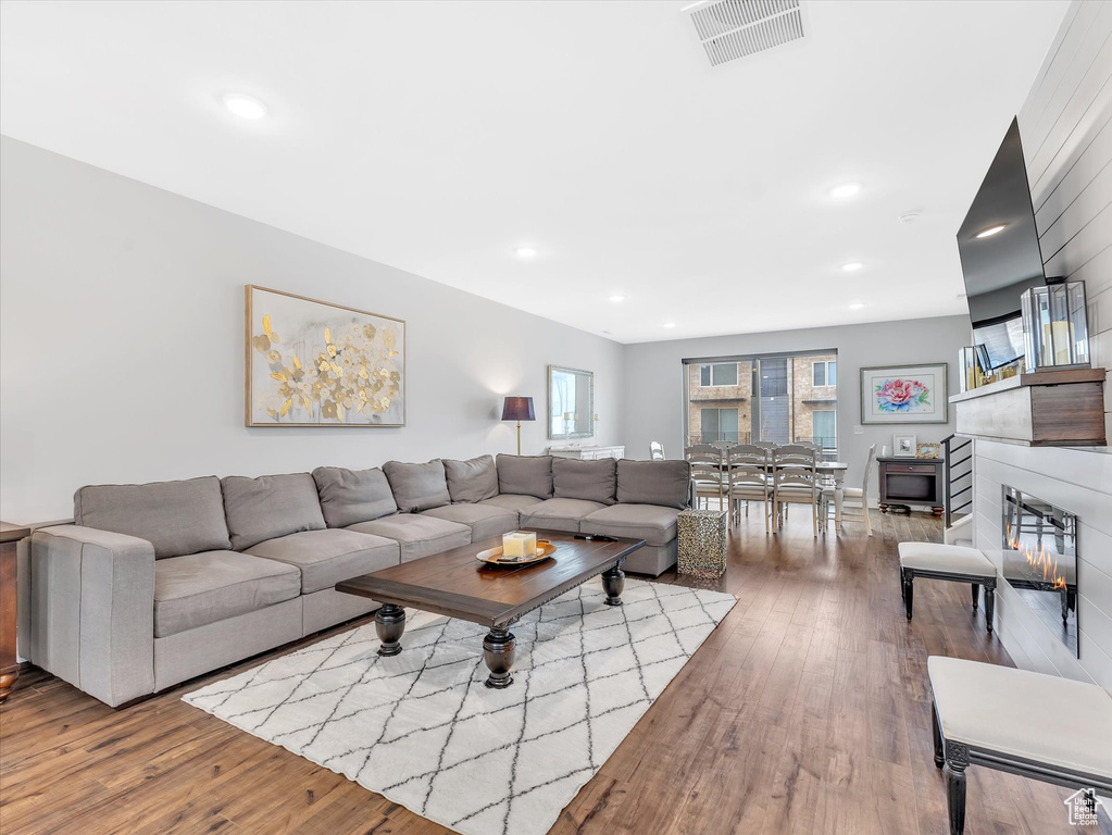Living room featuring wood finished floors and recessed lighting