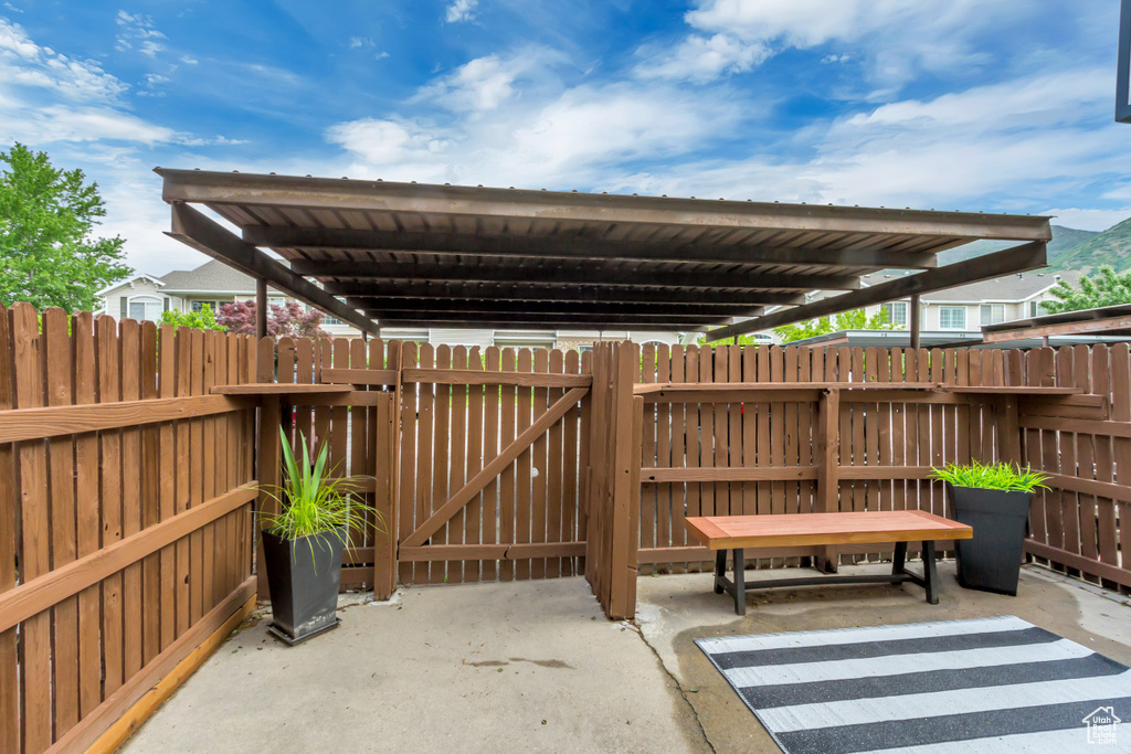 View of patio / terrace with fence and a gate