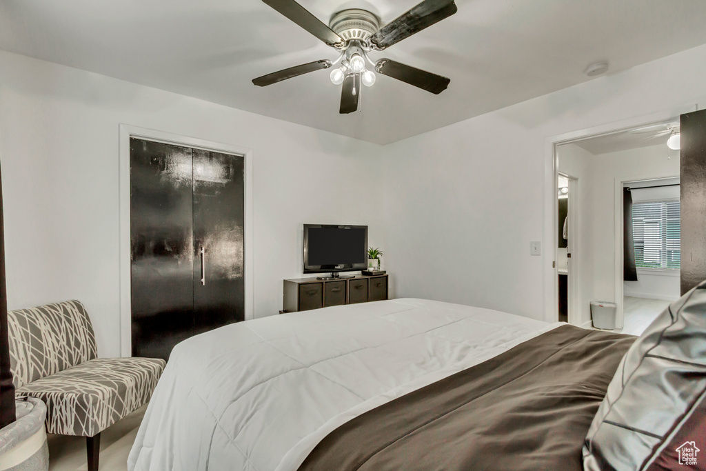 Bedroom featuring a ceiling fan and a closet