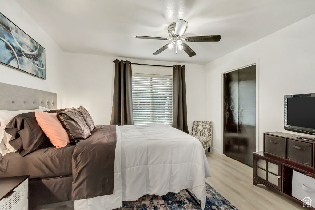 Bedroom featuring light wood-type flooring and ceiling fan