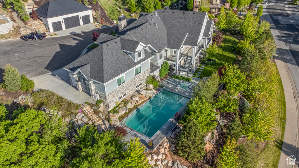 Aerial view of residential area featuring a pool area