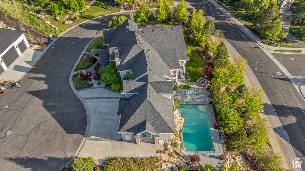 View of subject property with a pool