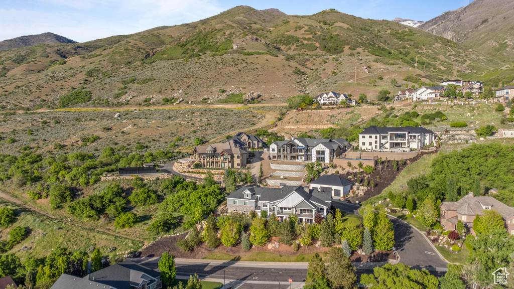 Aerial view of property\\\'s location with nearby suburban area and a mountain backdrop