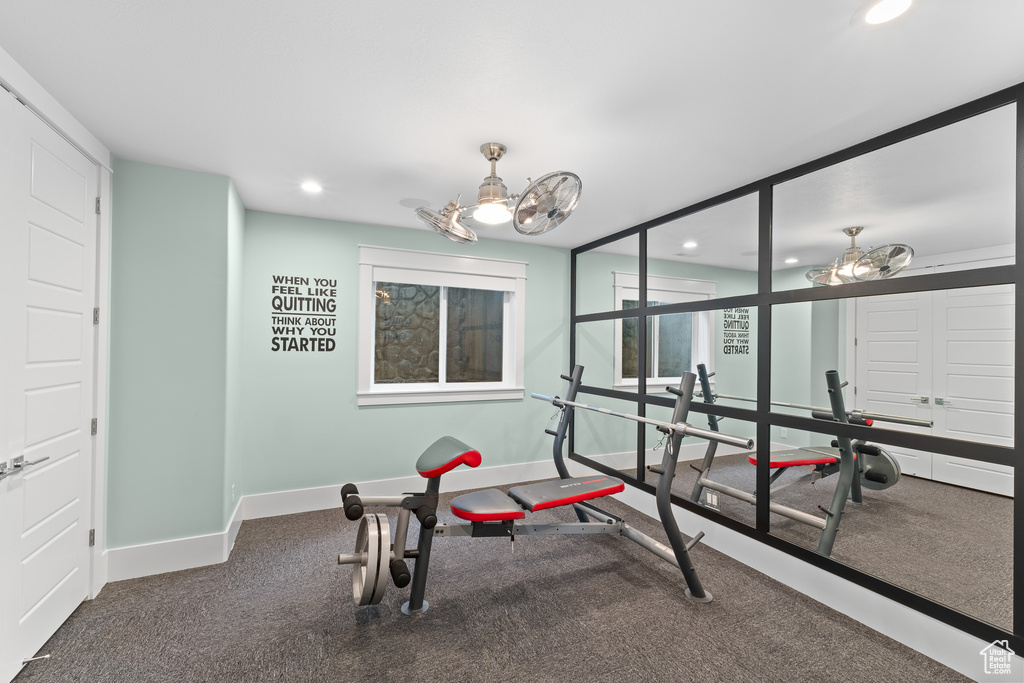 Workout room featuring baseboards and recessed lighting