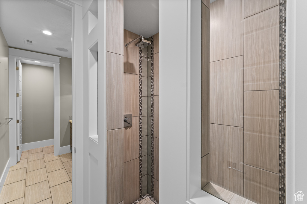 Full bathroom with tiled shower