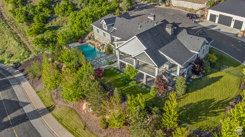 Aerial view of property and surrounding area with a pool area
