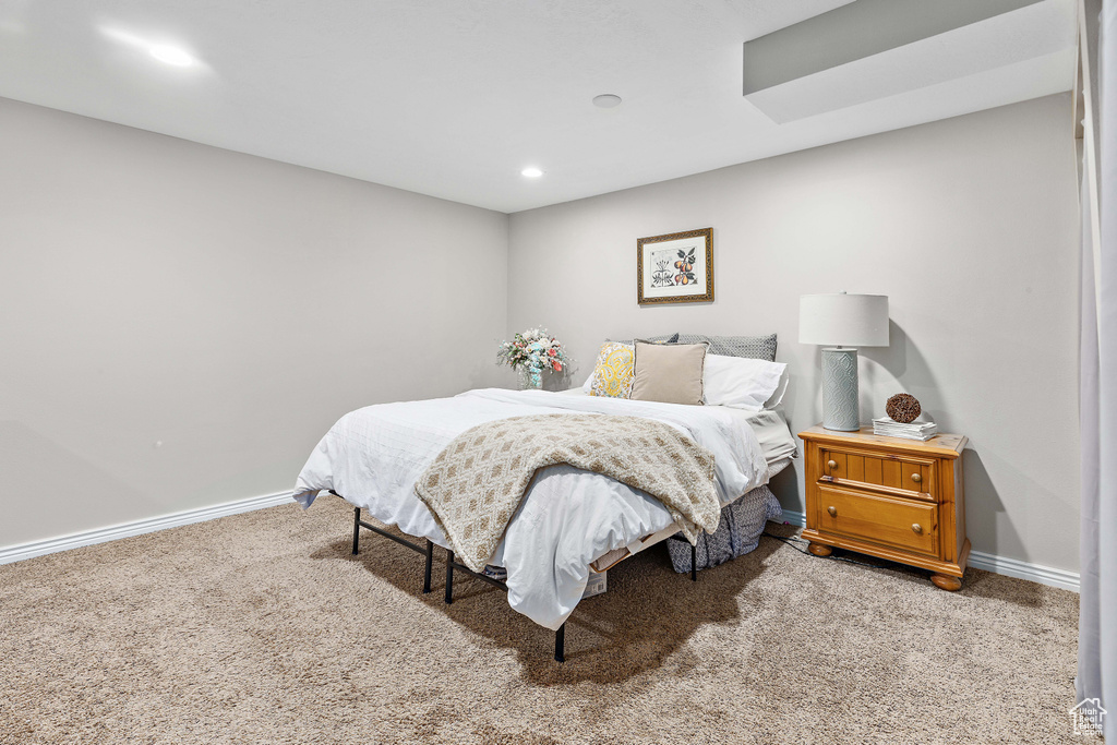 Carpeted bedroom featuring baseboards and recessed lighting
