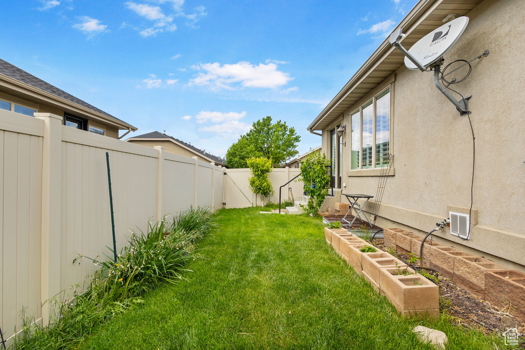 View of yard with a vegetable garden