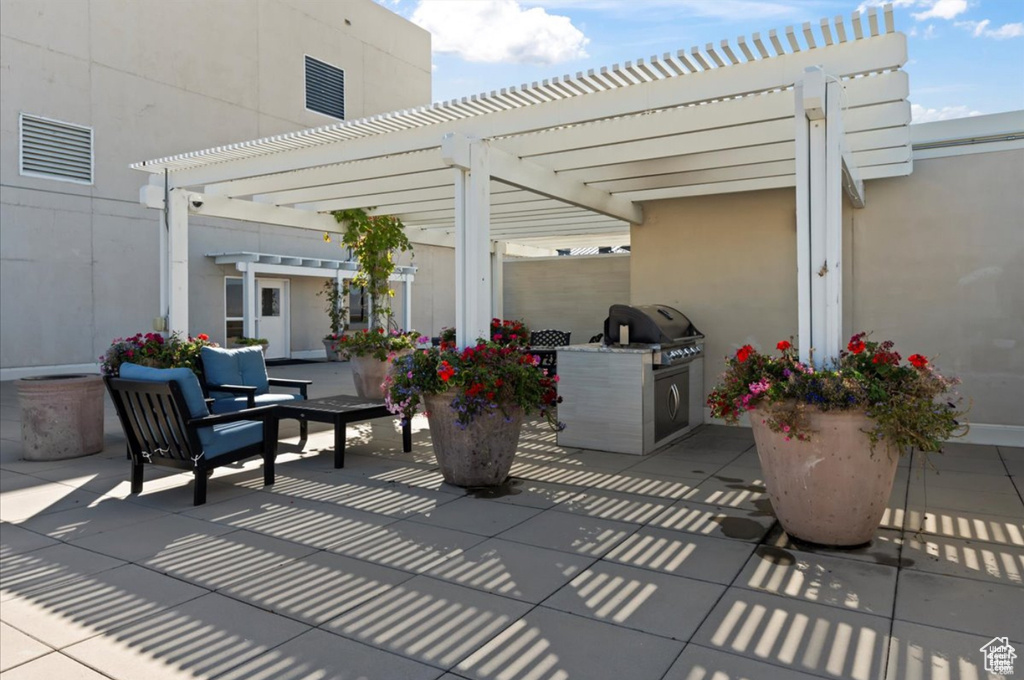 View of patio / terrace featuring a pergola and an outdoor living space