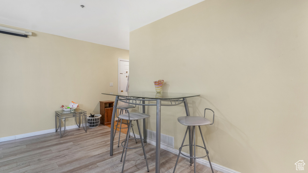 Dining room featuring wood finished floors and baseboards