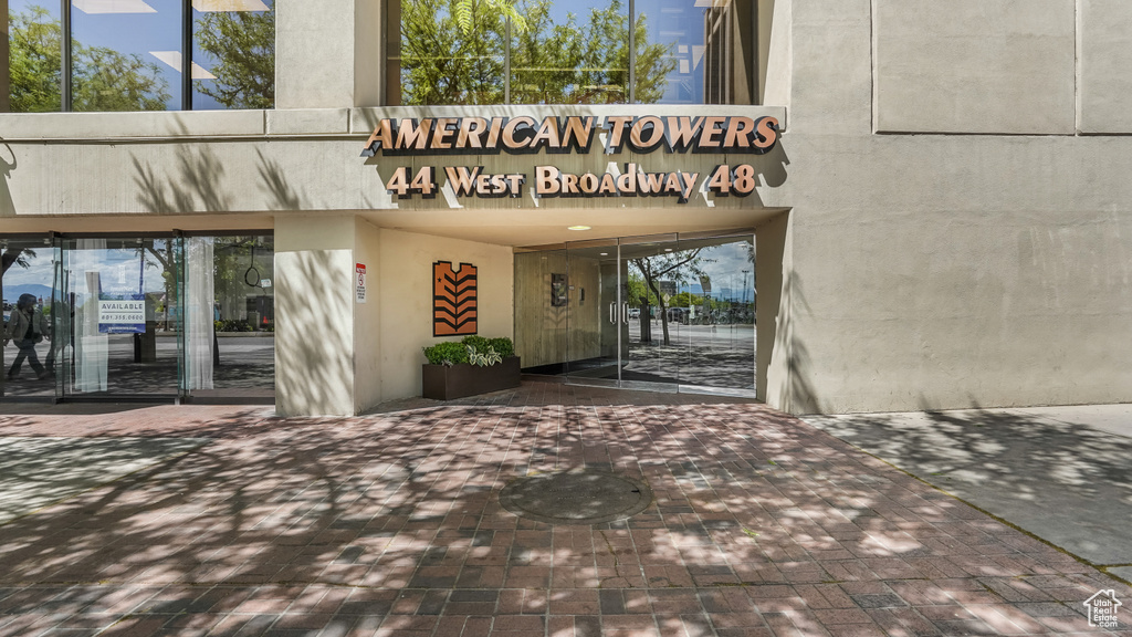 View of exterior entry featuring stucco siding