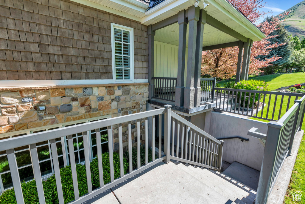 Balcony with covered porch and a mountain view
