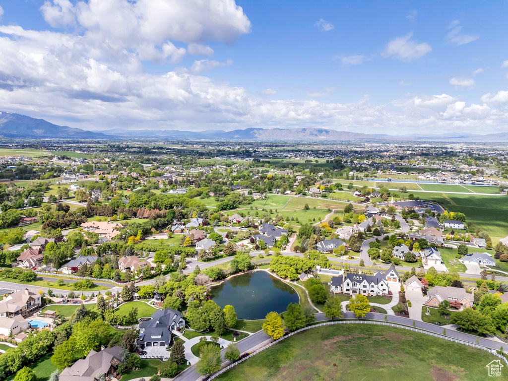 Aerial view of residential area featuring a water and mountain view