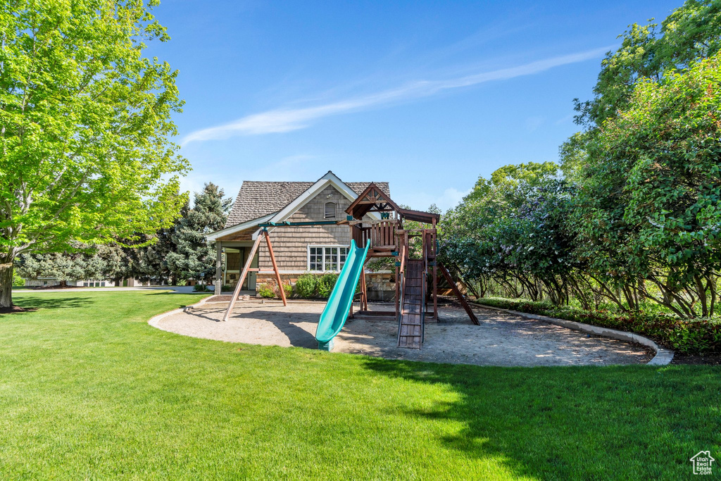 View of play area featuring a yard