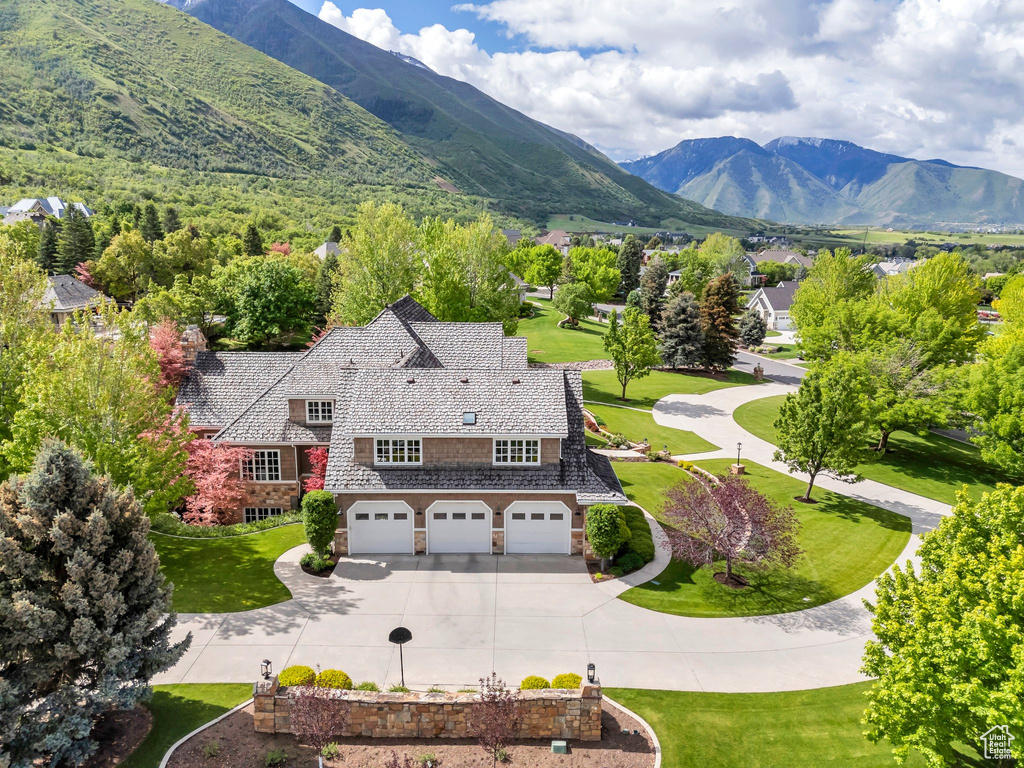 View of subject property featuring a mountainous background