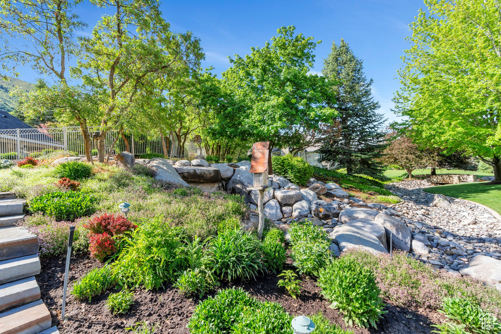 View of yard featuring fence