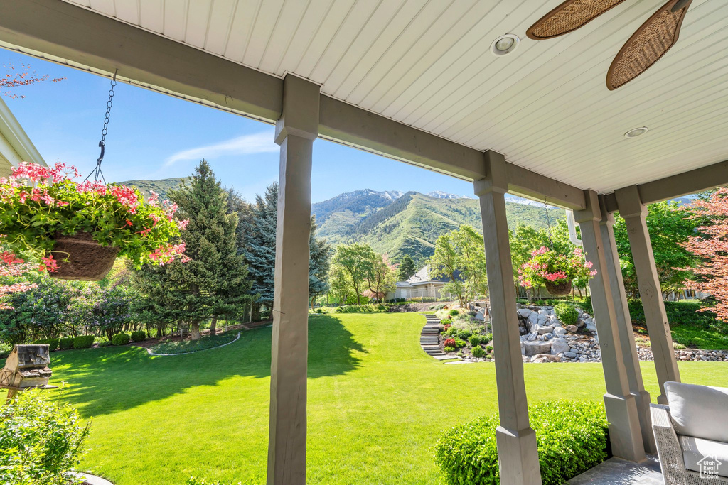 View of grassy yard with a mountain view