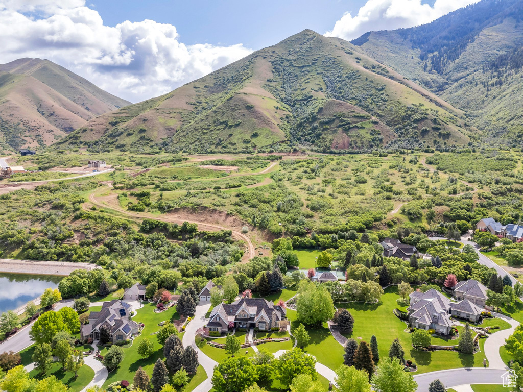 Aerial perspective of suburban area with a mountainous background