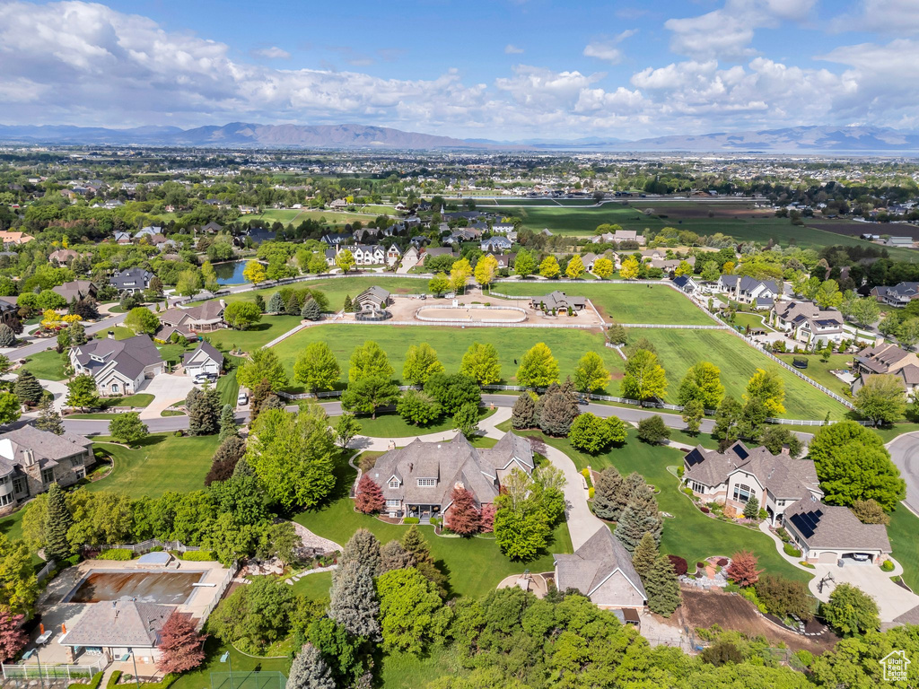 Aerial perspective of suburban area featuring a mountain backdrop