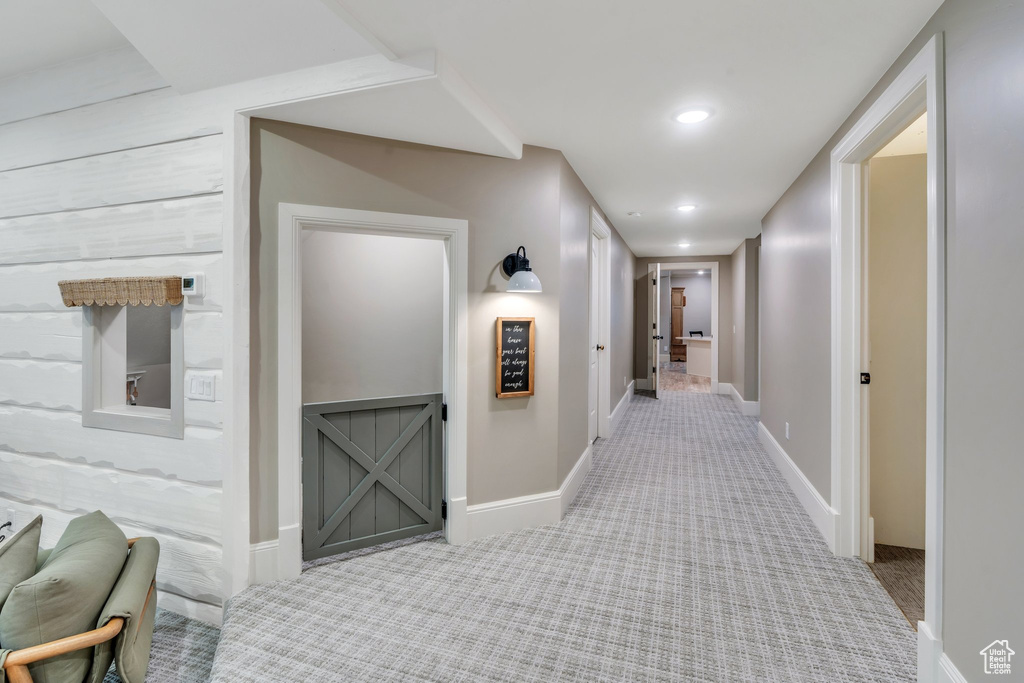 Hall featuring carpet, baseboards, and recessed lighting