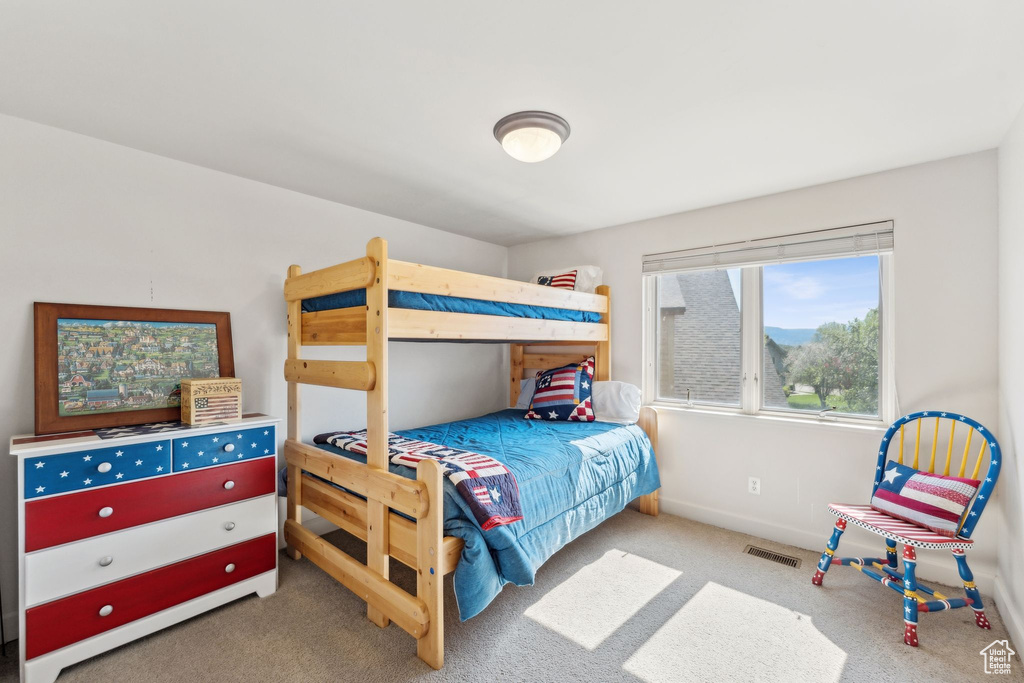 Carpeted bedroom with baseboards