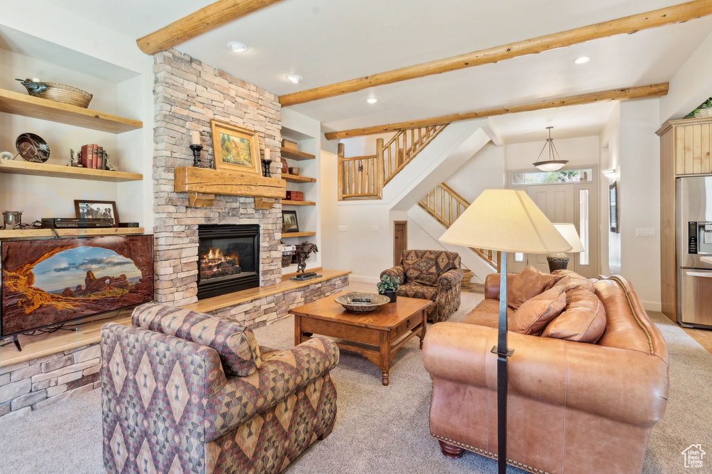 Carpeted living room with beamed ceiling, stairs, a fireplace, recessed lighting, and baseboards