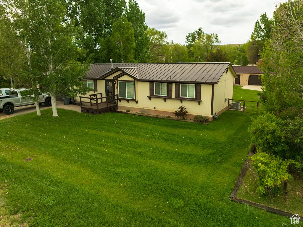 Single story home with a standing seam roof and metal roof