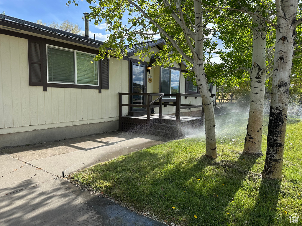 View of home\\\'s exterior with a yard