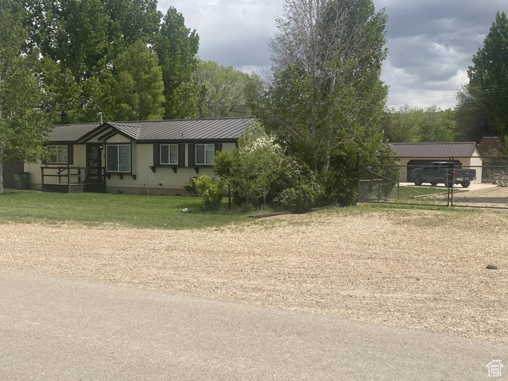 View of front of house with metal roof