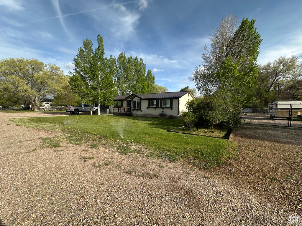 View of front of house featuring metal roof