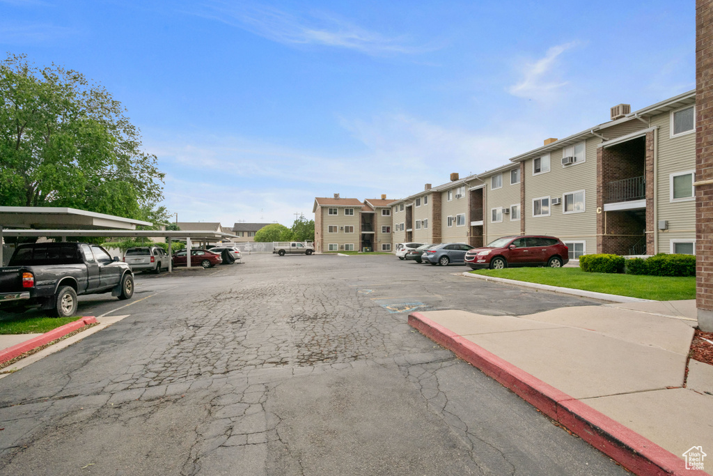 View of asphalt street featuring curbs