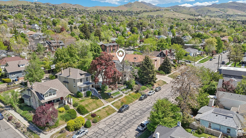 Aerial overview of property's location featuring nearby suburban area and mountains