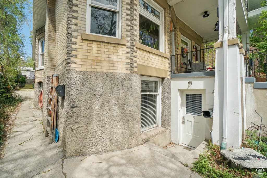 Entrance to property featuring stucco siding
