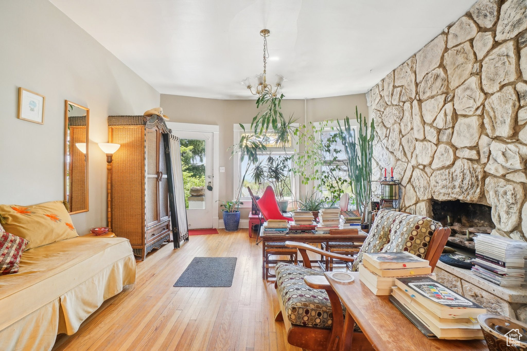 Living room featuring wood-type flooring and a fireplace