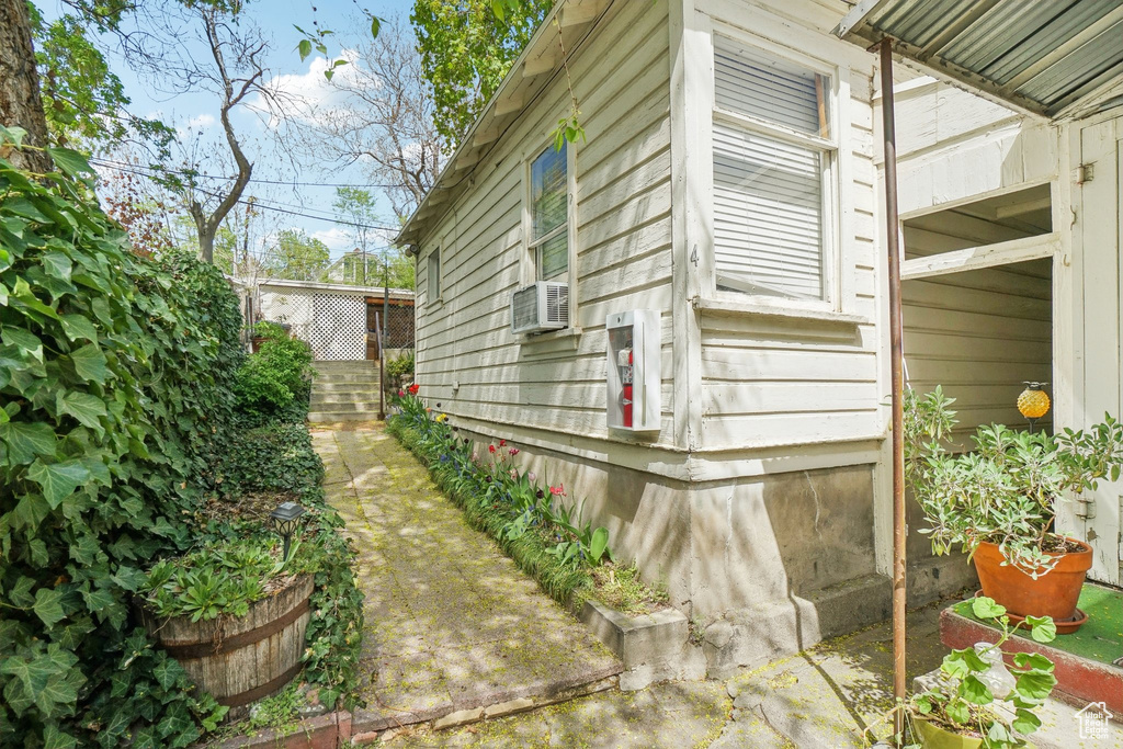 View of property exterior with cooling unit