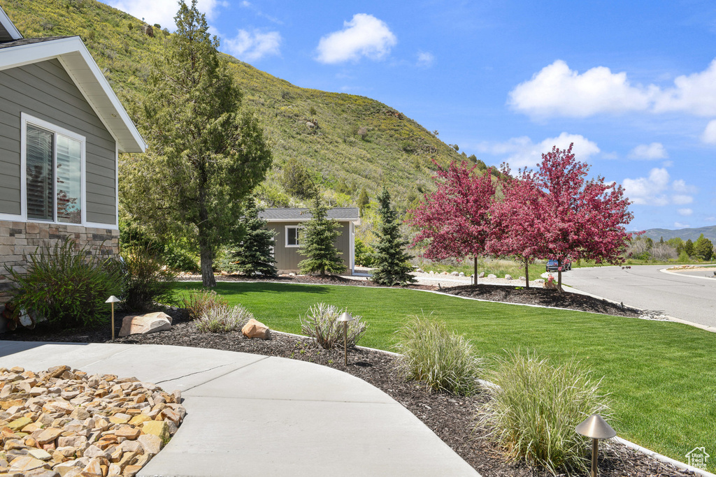 View of grassy yard featuring a mountain view