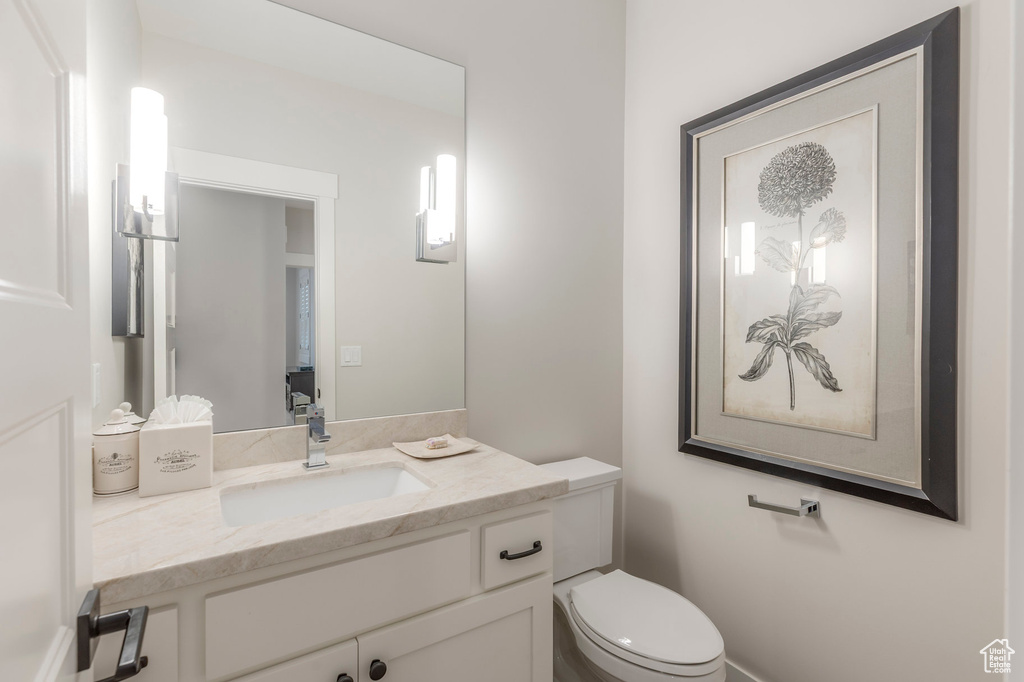 Half bath with toilet and vanity