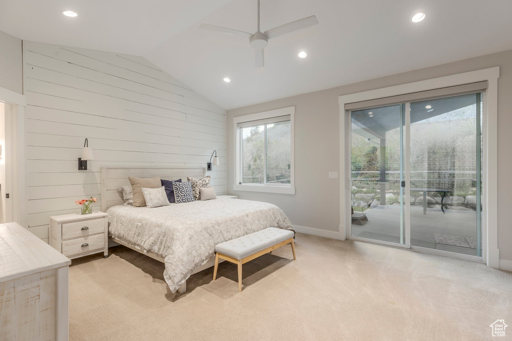 Bedroom featuring access to exterior, vaulted ceiling, baseboards, recessed lighting, and light carpet
