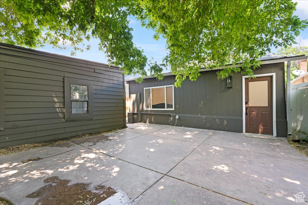 View of patio featuring an outbuilding