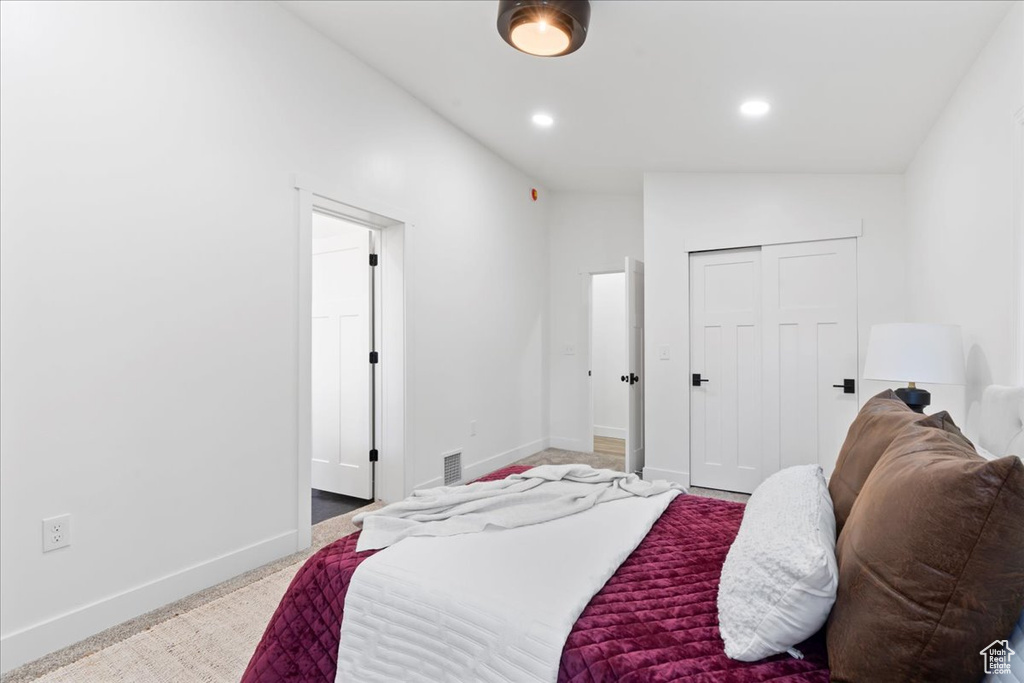 Bedroom featuring baseboards, a closet, and recessed lighting