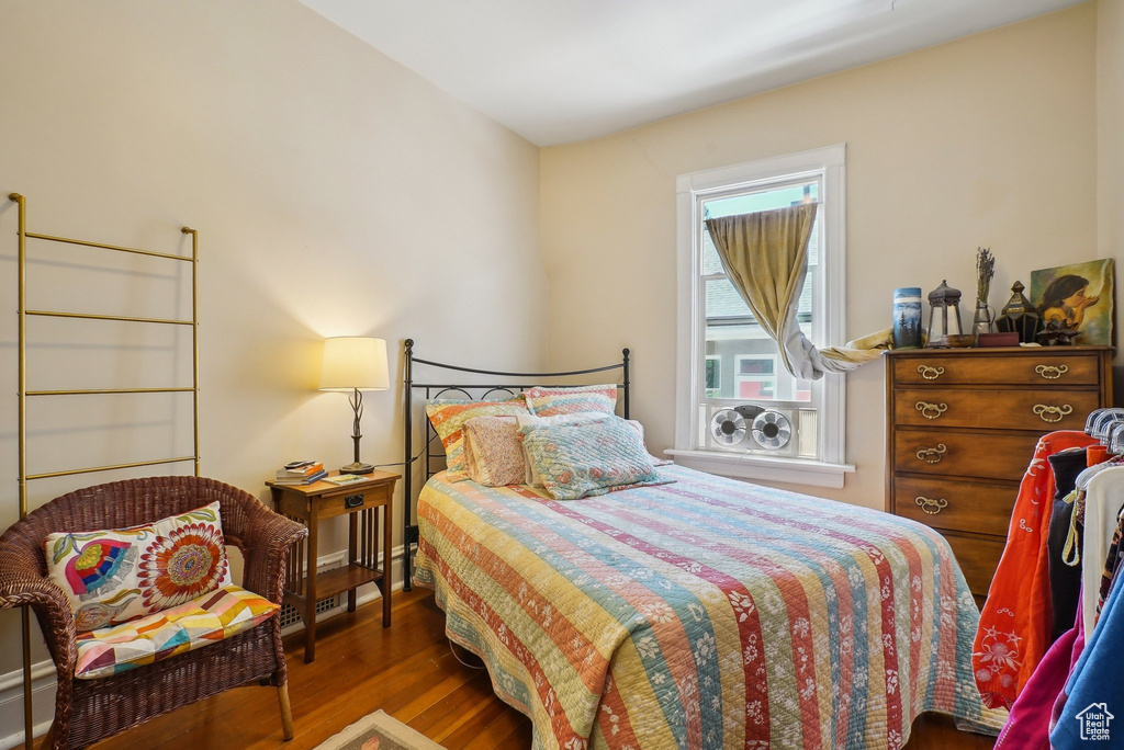 Bedroom with wood finished floors