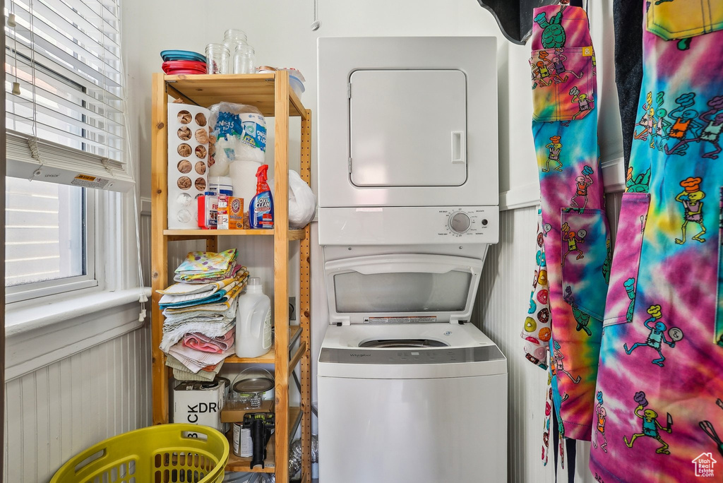 Laundry area featuring stacked washer / dryer