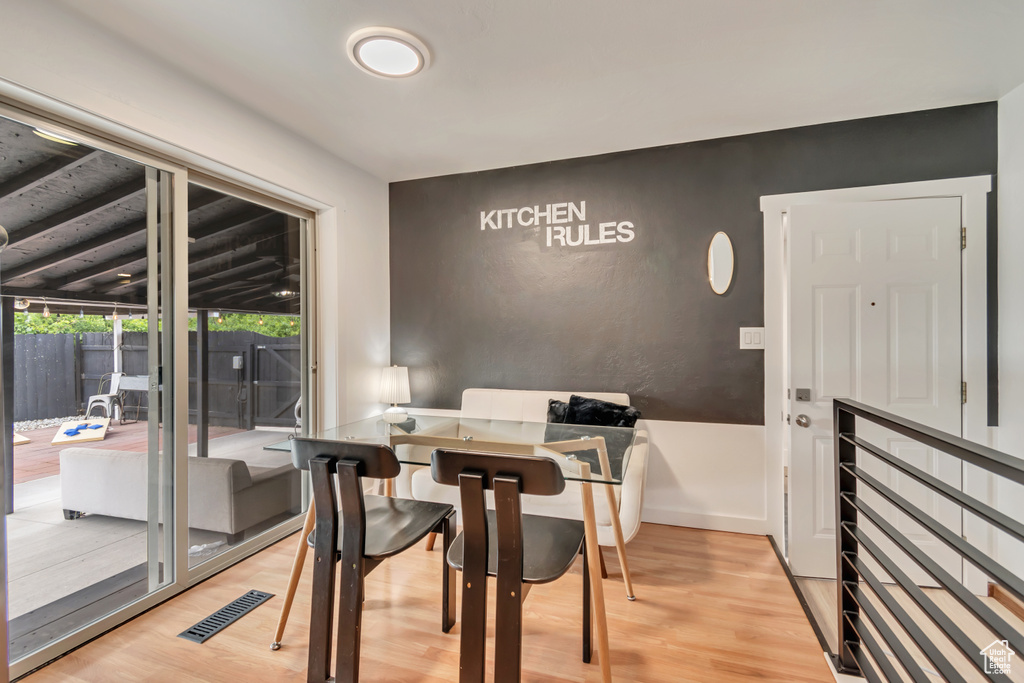 Dining space featuring light wood finished floors and baseboards