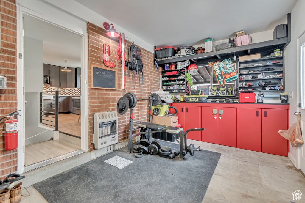 Workout room featuring heating unit