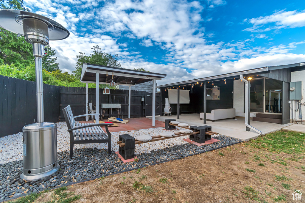 View of patio / terrace with a fenced backyard and a deck