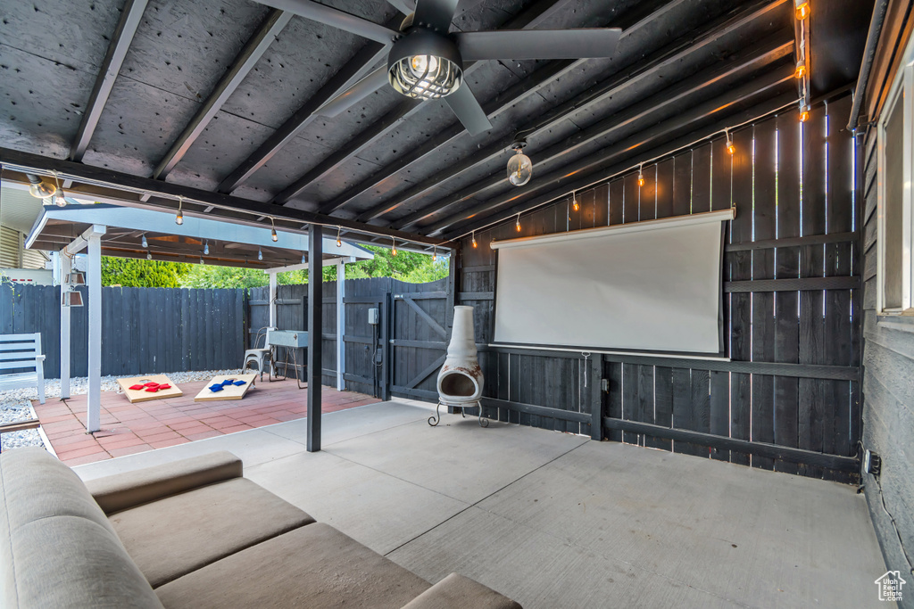 View of patio with a gate, a fenced backyard, and ceiling fan
