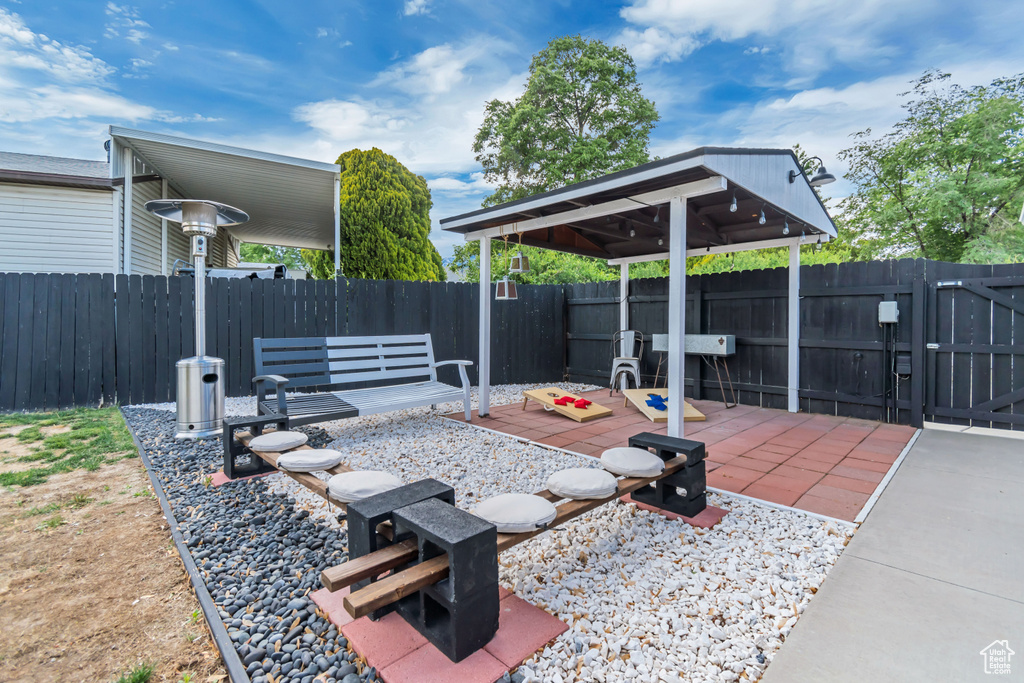 Fenced backyard featuring a gazebo